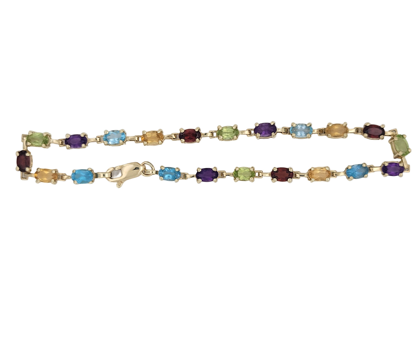 10K gold bracelet with colored CZ stones. 7 5in. 3mm