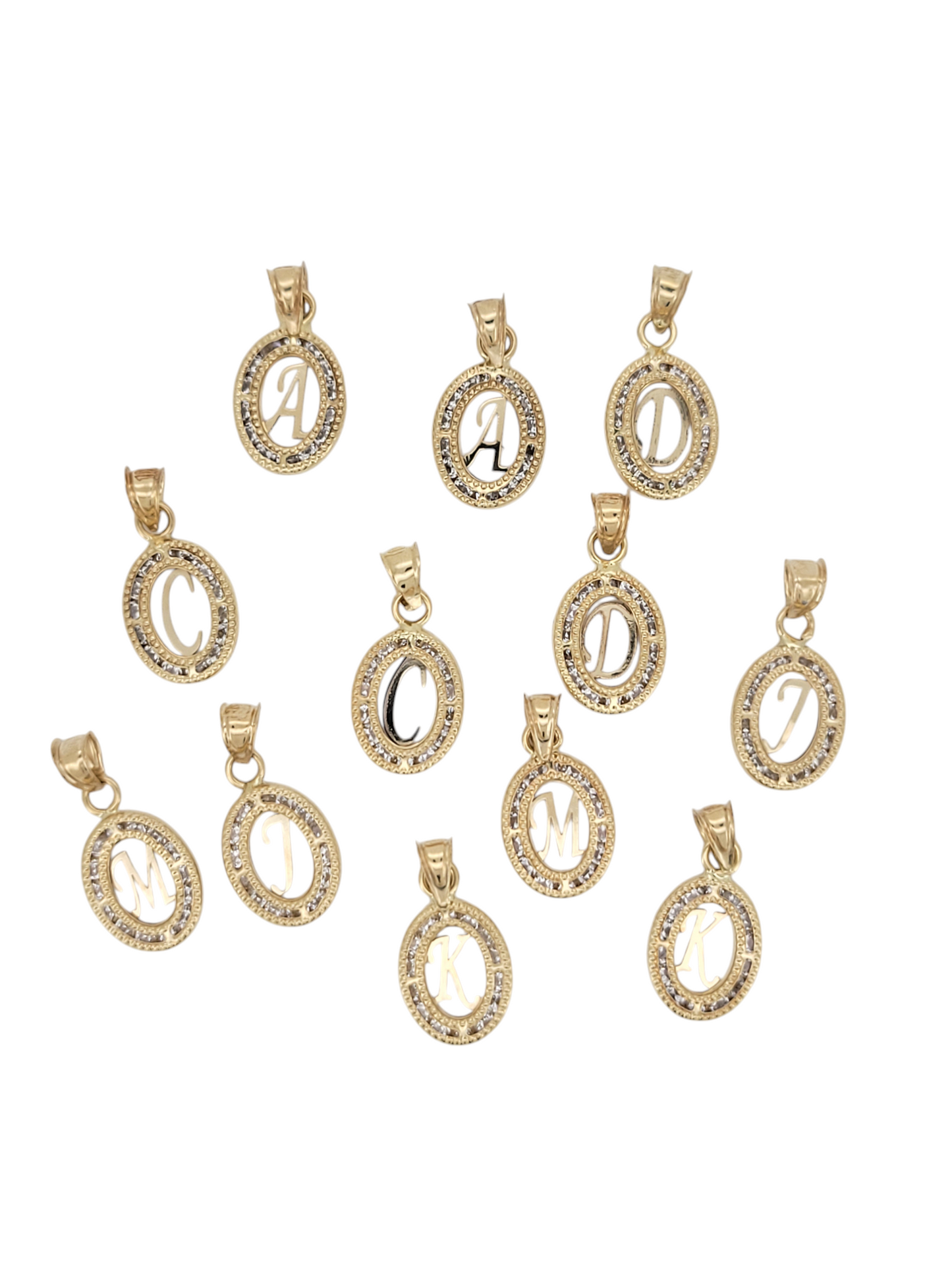 10K gold pendants. Central letters. CZ stones.
