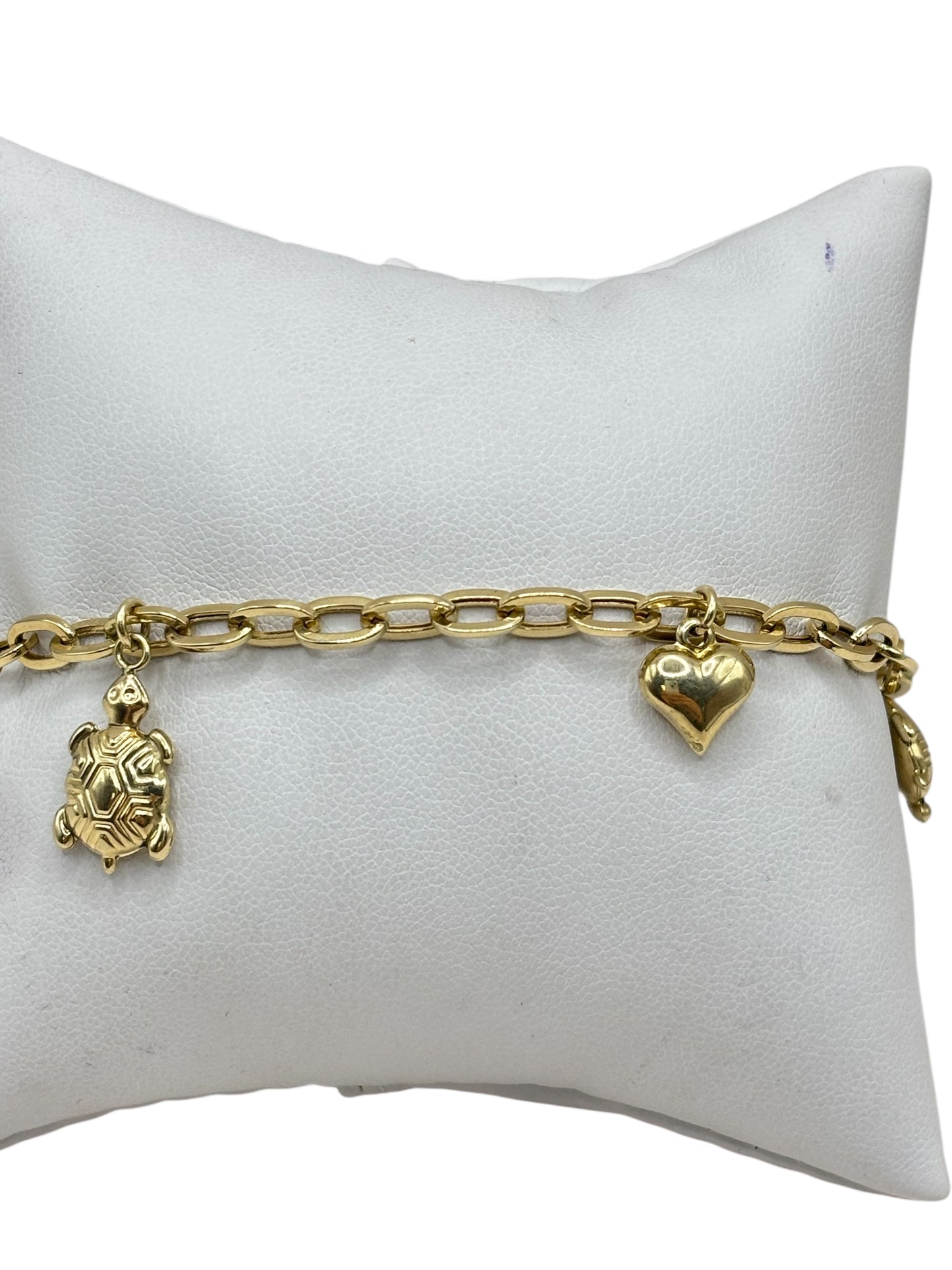 10k gold bracelet with charms of turtles and hearts 8in 4.6mm