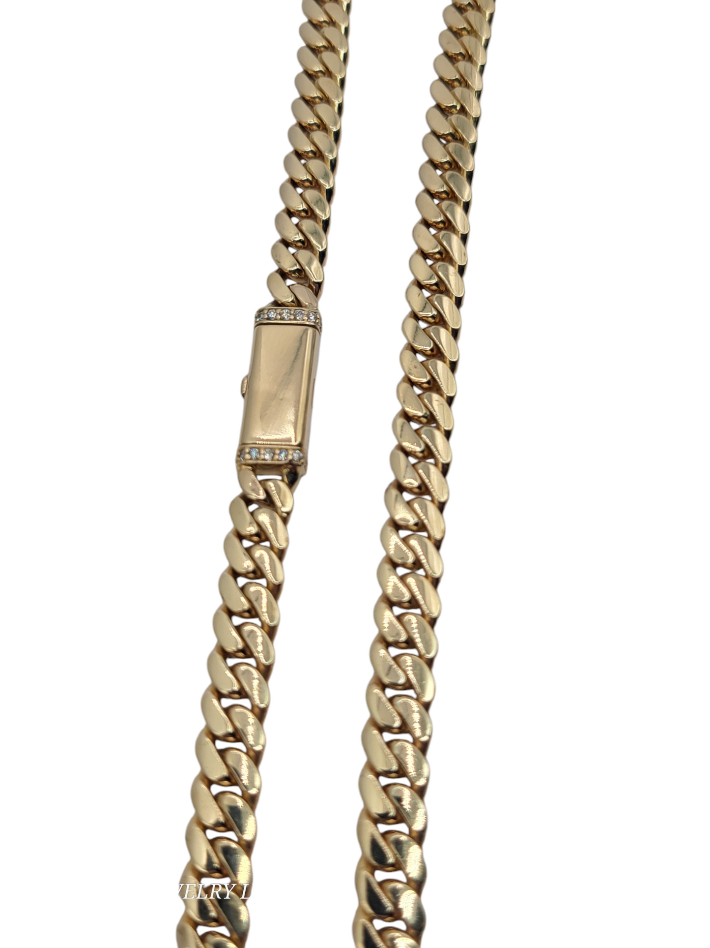 10K gold 24in 7mm Cuban chain.  80.4g with real diamonds