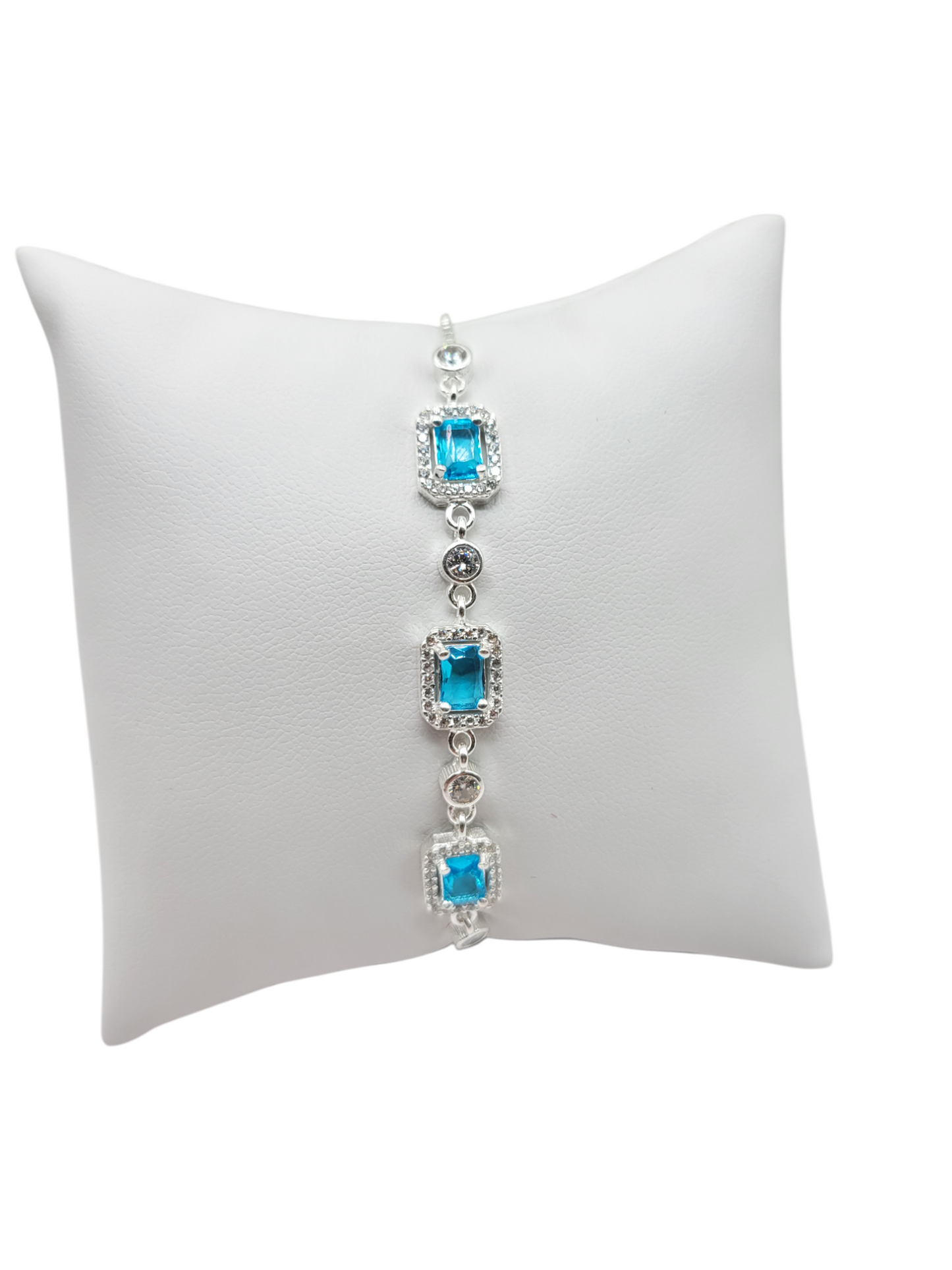 925 sterling silver bracelet. Three light blue square CZ stones. 10 inches adjustable. 2mm