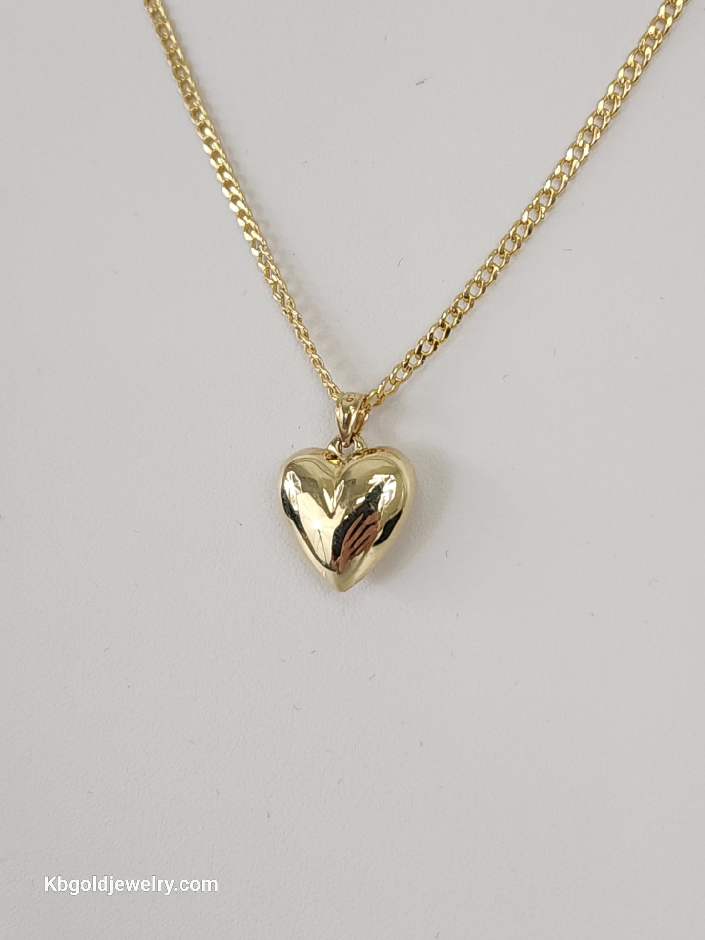 14K Cuban style gold chain with heart pendant