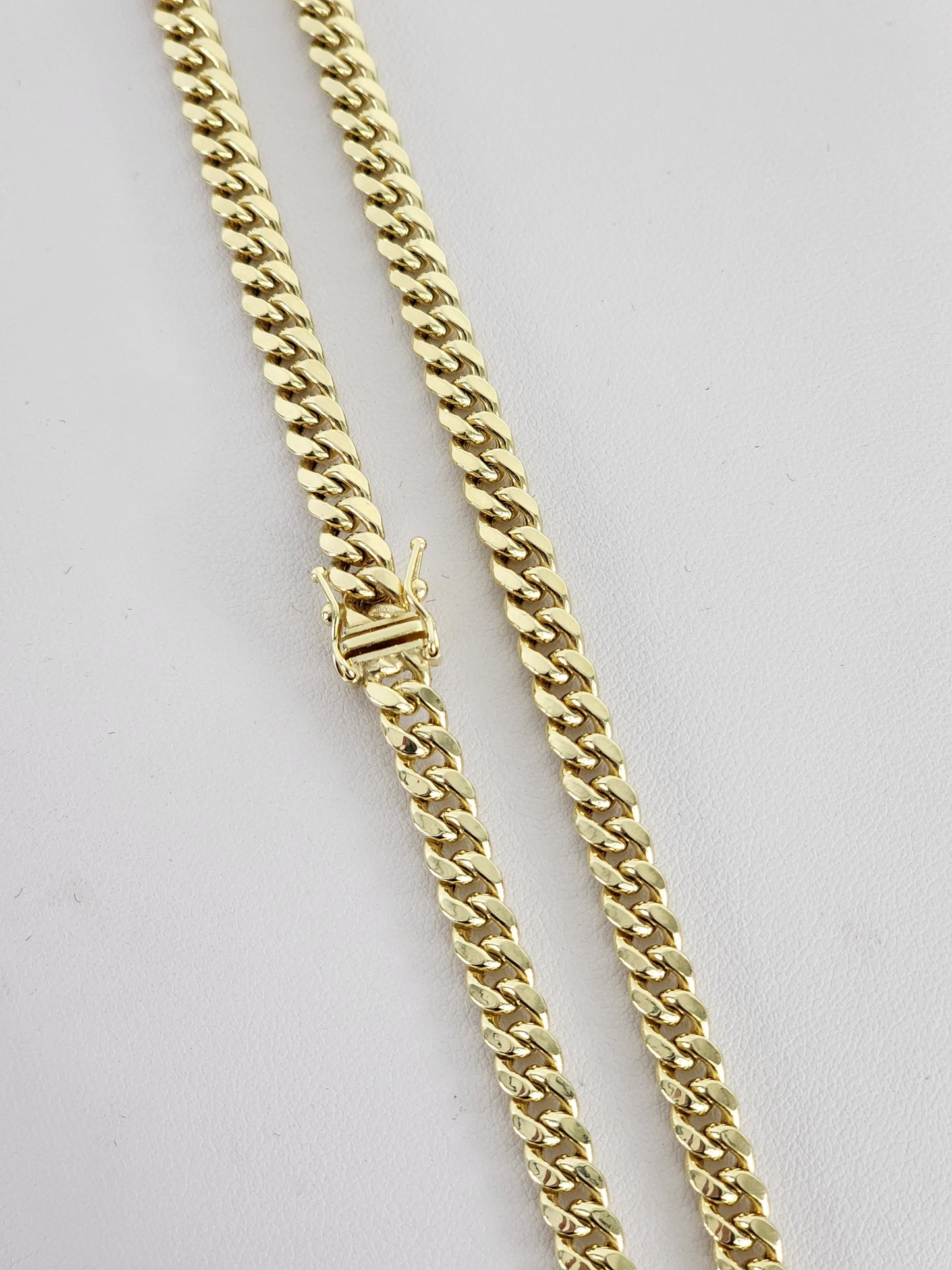 10k gold Cuban chain, size 22 and 18