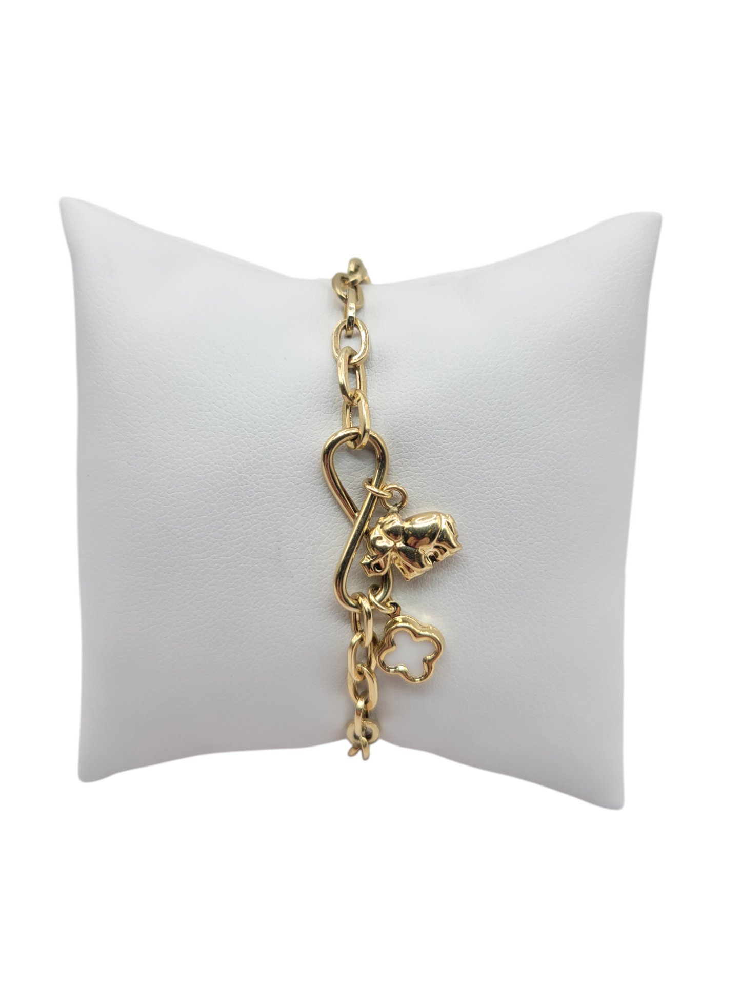 10K gold bracelet with an infinity symbol and elephant and white flower. 7 inches. 5 mm.