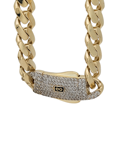 14K gold Cuban chain. Monaci. Clasp with CZ stone. 24in . 7mm
