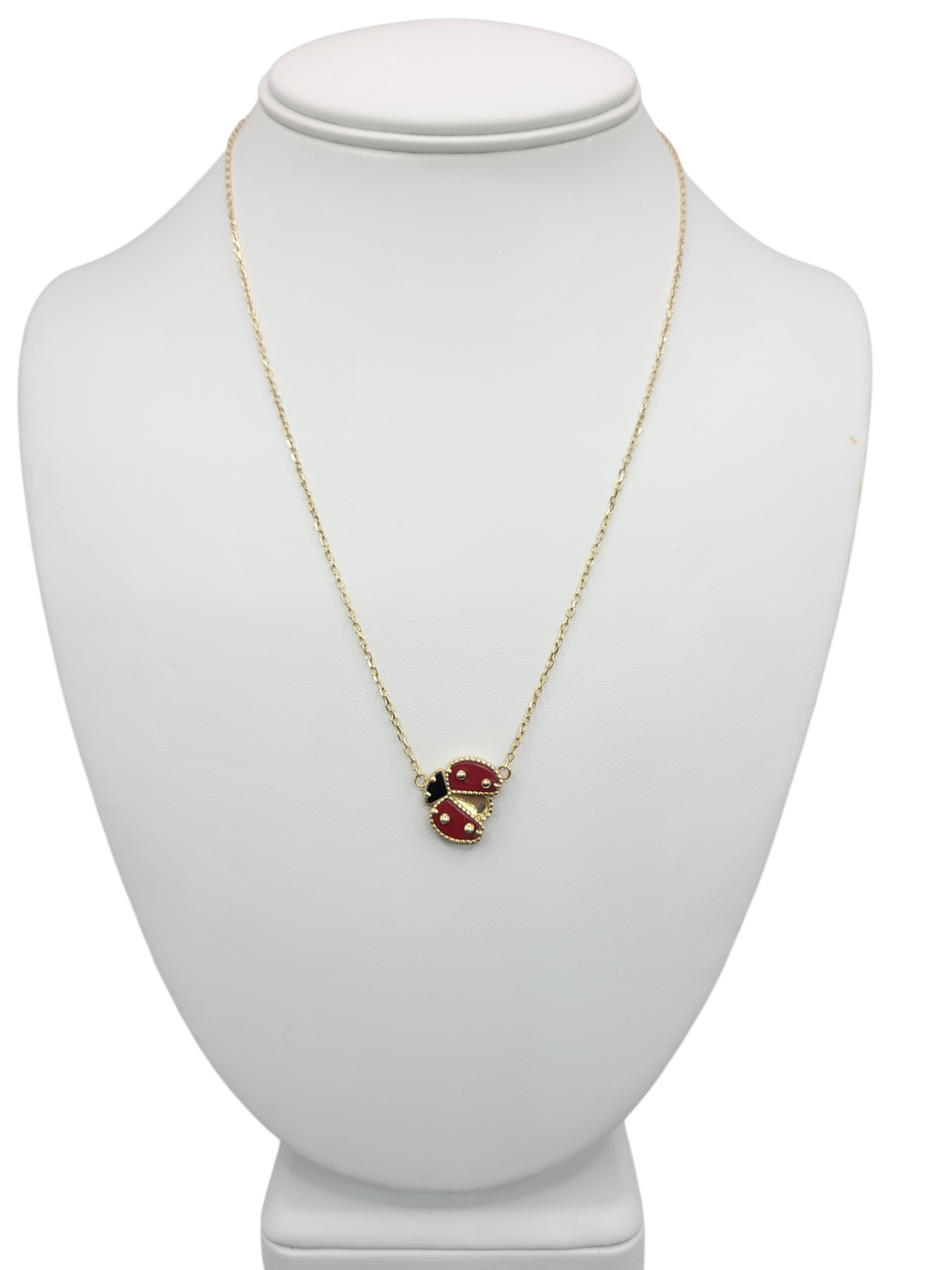 10K gold necklace with ladybug pendant . 18in . 1mm