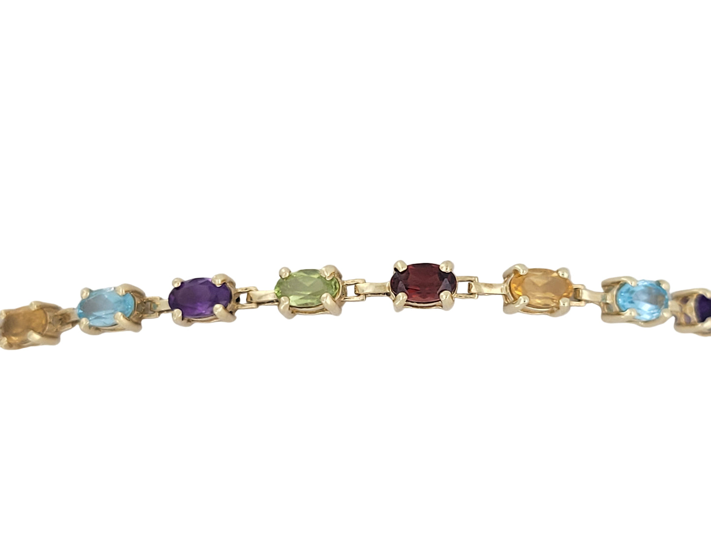10K gold bracelet with colored CZ stones. 7 5in.  3mm